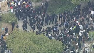 Officers respond to UCLA as protesters try to push into proPalestinian encampment [upl. by Donadee]