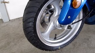 Taotao ATM150A Evo scooter  front wheel installation with Kenda K413 13060R13 tire [upl. by Azrim]