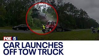 Car launches off back of tow truck  FOX 5 News [upl. by Darees]