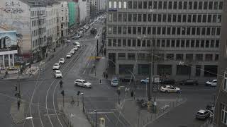 Busy intersection with yellow cabs taxis driving trough on cloudy day in Berlin Germany German taxi [upl. by Seabrook741]