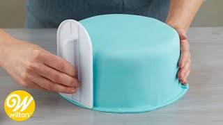 How to Cover a Round Cake with Fondant  Wilton [upl. by Grodin]