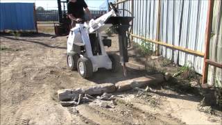 RAMROD Mini Skid Loader 950 with Hydraulic Hammer Attachment [upl. by Airdnat]