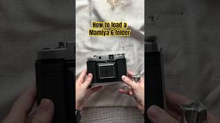 Loading film into a Mamiya Six Folding Camera film filmcamera [upl. by Anirbak466]