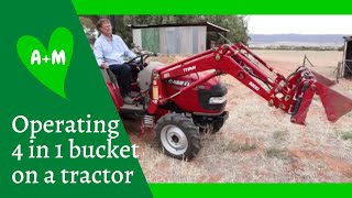 How to operate a frontend loader with 4 in 1 bucket on a tractor [upl. by Adnahsed]