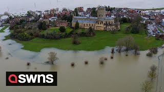 UKs Tewkesbury Abbey turned into an island as flood water streams off the Malvern Hills  SWNS [upl. by Feigin]