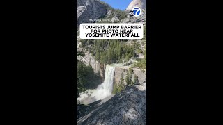 Tourists jump barrier for photo near Yosemite waterfall [upl. by Nalon]