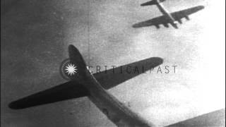 A burning American B17 aircraft falls through clouds in Germany HD Stock Footage [upl. by Naimerej]