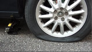 How To Change A Flat Tire Like A Boss [upl. by Ayihsa]