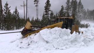 Plowing snow from roads in the spring in Yellowstone National Park [upl. by Nilknarf]