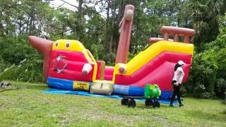 Julie roll up the pirate ship bounce house using the deflator [upl. by Bigford920]