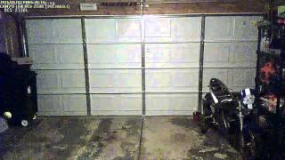 garage door tension spring breaks on security camera [upl. by Annazor]