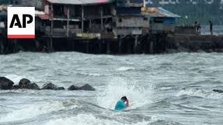 Floods in Philippines kill at least 9 and trap others on roofs [upl. by Irah19]