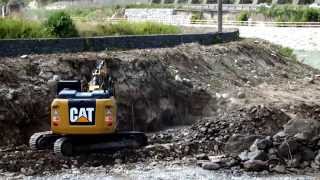 CAT 323E LN Excavator Digging Rocks In River Bed [upl. by Eiboj]