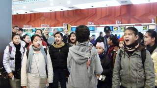 Loboc Childrens Choir sings IKAW at Madrid Airport [upl. by Garrity]