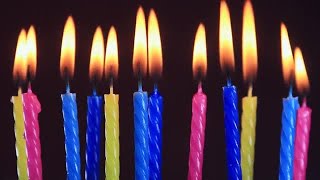 Colorful Birthday Candles Burning Stock Video [upl. by Atterahs917]