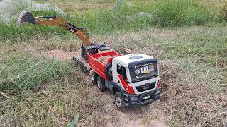 RC Cat 336D loading dirt Bruder MAN TGS [upl. by Sardse866]