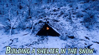 BUILD a SHELTER in SNOW I built a wooden hut with FIREPLACE  under °ZERO DEGREES [upl. by Gnuhc]