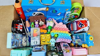 Box full of fancy stationery items  jumbo pencil box calculator watch popit pouch pen eraser etc [upl. by Orrocos]