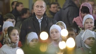 Putin attends Russian Orthodox Christmas Eve Mass [upl. by Enomrej]