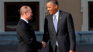 Obama and Putin greet with long handshake [upl. by Goldston]