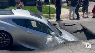 Car falls into sinkhole as street collapses in Southwest Detroit [upl. by Sinnej]