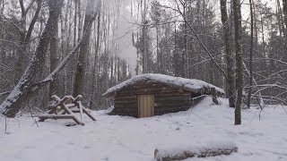 hiding in a huge dugout during a snow storm spending the night in bushcraft shelter [upl. by Vachel987]