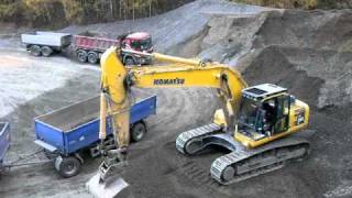 Komatsu PC 290 LC excavator loading a truck w trailer [upl. by Yllehs]