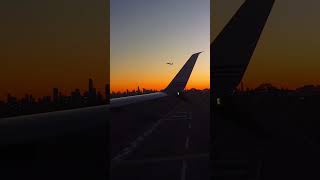 NYC Skyline Silhouette from Plane Window 🌅✈️ NYC SkylineSunrise PlaneTakeoff [upl. by Ruel360]