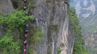 Chinese children climb 800m cliff to get home from school [upl. by Dnarb]