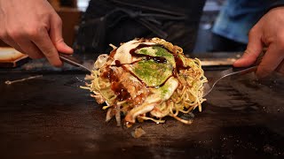 Eating Michelin Guide Okonomiyaki in Osaka Japan [upl. by Marb]