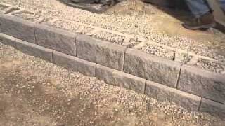 DIY Superstore  Installing a Retaining Wall [upl. by Erej]