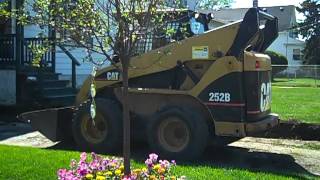 Cat skid steer working on a drive way [upl. by Jemina]