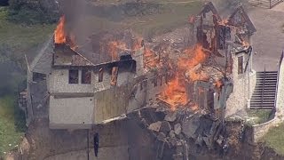 Burning down the house Texas family burn down luxury home that hangs over 75ft cliff [upl. by Nobie632]