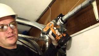 Installing A Garage Door Part 4 Tensioning the EZ Set Torsion Spring [upl. by Killie816]