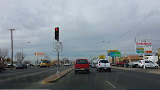 Driving down a major city street Menaul Blvd in Albuquerque New Mexico Thrift Store Row [upl. by Asirem296]