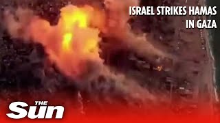 Aerial footage shows Israeli air strikes blowing up Hamas targets in Gaza [upl. by Sirois788]