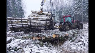 Valtra A93 forestry tractor logging in winter forest large fully loaded trailer [upl. by Rasmussen]