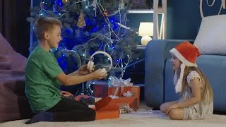 Kids Unwrapping Christmas Gifts At Home Stock Video [upl. by Nattirb]