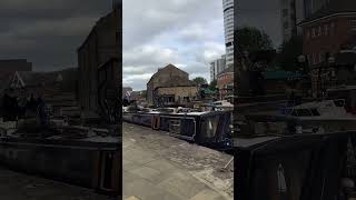 The view at Granary Wharf in Leeds moored narrowboats and old warehouse wharf buildings waterways [upl. by Edveh]