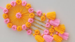 DIY Easy Woolen Flower wall hanging craft ideasWoolen wall hangingWoolen craftWoolen torantoran [upl. by Ivz659]