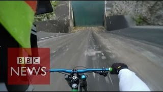 Biker films insane 60m bike dam drop in Slovenia  BBC News [upl. by Pascia]