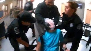 Shocking police video of woman being tased while restrained lawsuit [upl. by Ierdna]