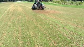 Golf Course fairway aeration  dragging the cores to incorporate seed [upl. by Tor]