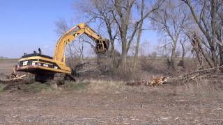 CAT 345 BL Series II Excavator taking out trees [upl. by Keller]