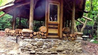 Off grid roundhouse build part 12 cordwood walls lime plaster and flooring [upl. by Gnov911]