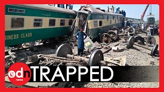 Pakistan Train COLLISION Leaves Dead and Injured Trapped in Mangled Wreckage [upl. by Ihcego]