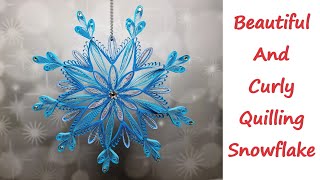 How to create a beautiful quilling snowflake with Swarovski accents  Easy Christmas tree decoration [upl. by Tindall650]