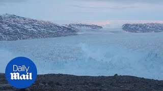 Monstrous iceberg seen breaking off Greenland glacier [upl. by Nanaek617]