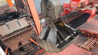 Unloading a 300 meter coal bulk ship Bucket crane with massive bucket close to the wheelhouse [upl. by Naleag868]