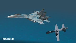 How A Russian Warplane Hit An Unarmed US Drone  Insider News [upl. by Edyak380]